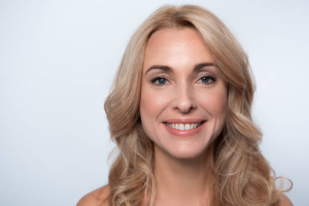 istock Optimistic middle-aged woman is feeling happiness 890819550