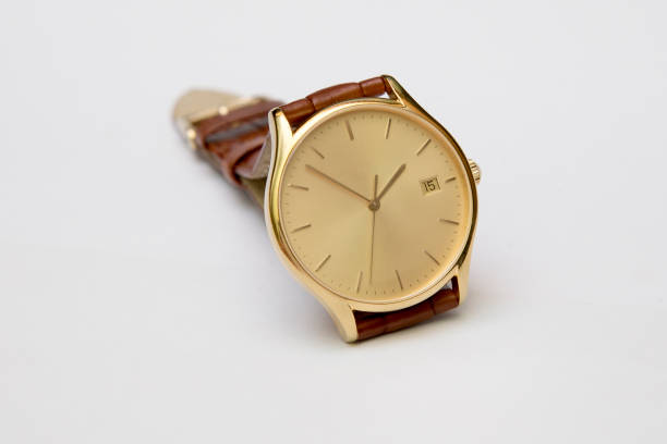 istock Men's gold watch with leather strap isolated on white background 890822072