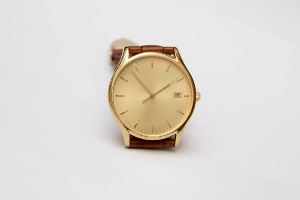 istock Men's gold watch with leather strap isolated on white background 890822196