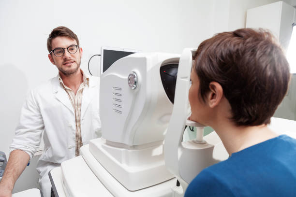 istock eye Doctor is measuring a patient's visual field 890822380
