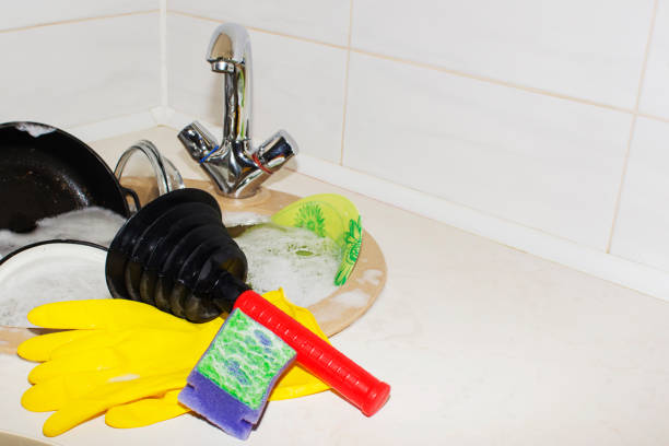 huge heap of dirty dishes waiting for the flatmate huge heap of dirty dishes waiting for the flatmate. a clog in the kitchen sink flatmate stock pictures, royalty-free photos & images