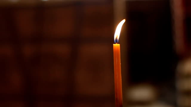 Single lit candle
