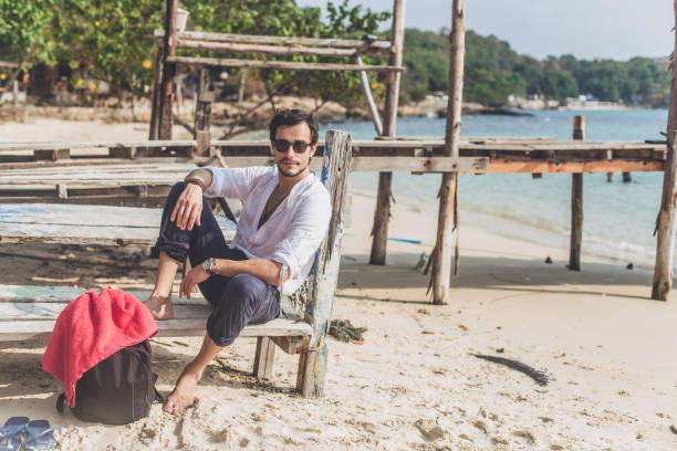 istock Sitting on the beach and enjoying the sun 890834272