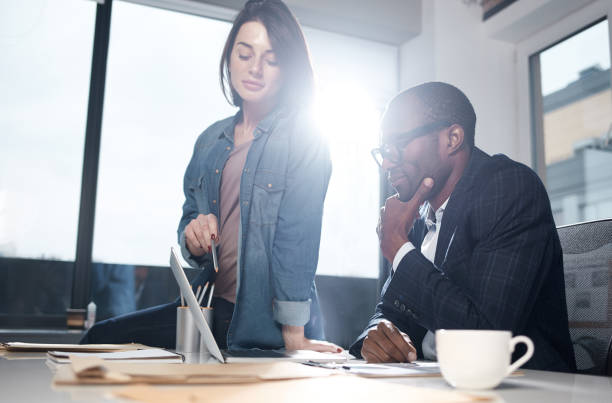 istock Serious coworkers are implementing new ideas 890837352