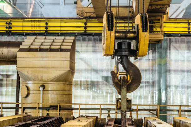 Steel hook of overhead crane over industrial equipment stock photo