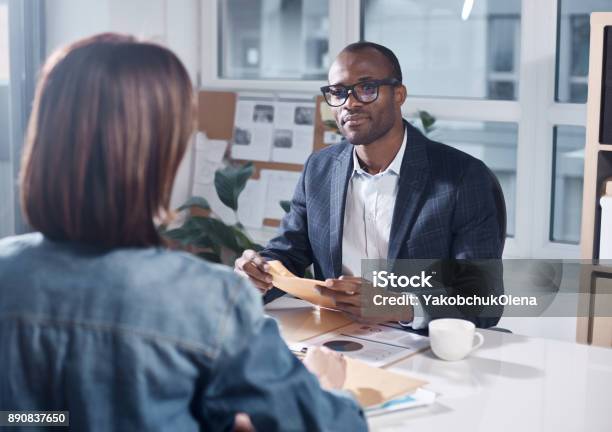 Professional Colleagues Are Discussing Project Stock Photo - Download Image Now - Benefits, Manager, Serious