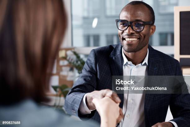Optimistic Qualified Man Is Interviewing Lady Stock Photo - Download Image Now - Job Interview, Handshake, Men