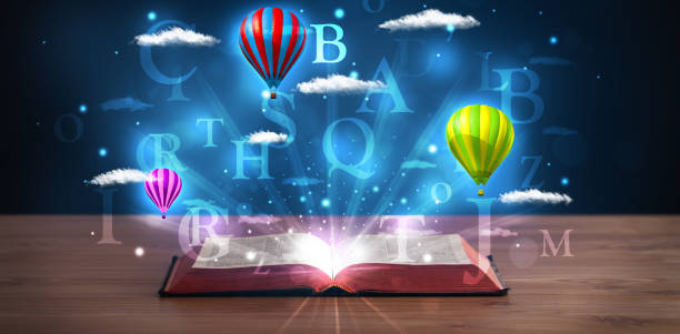 istock Open book with glowing fantasy abstract clouds and balloons 890837878