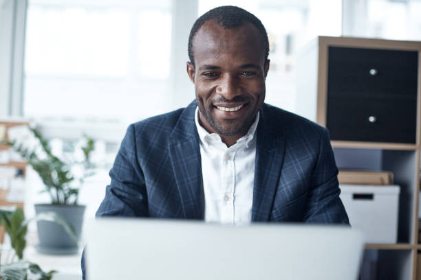 istock Positive adult employee is working on notebook 890837932