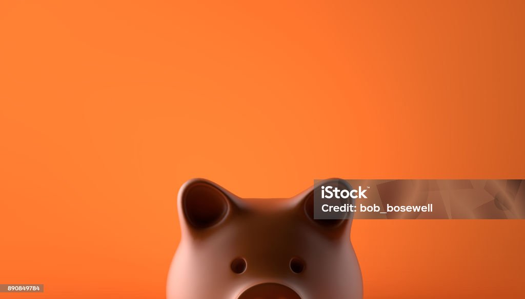 Piggy Bank Piggy bank over orange background Savings Stock Photo