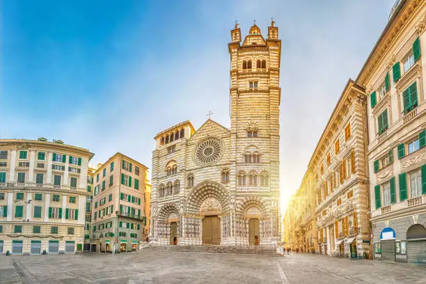 Cathedral of Genoa on sunrise - view from Piazza San Lorenzo square in Genoa, Liguria, Italy