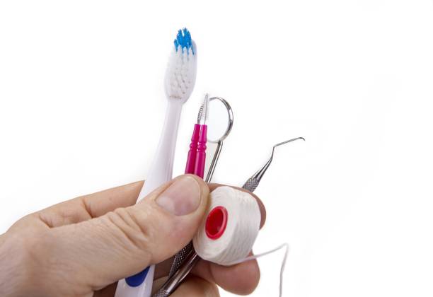 istock Dental tools with toothbrush interdental pick and floss 890850412