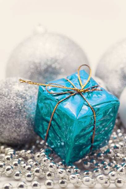 istock Silver Christmas decoration, balls, beads, bell close up isolated 890860902