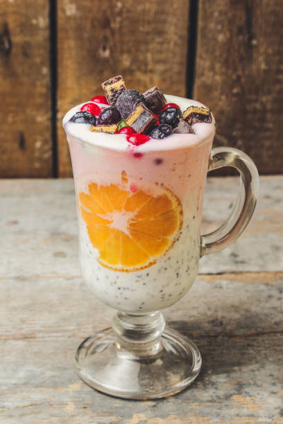 istock cocktail with berries and chia seeds (pink and white layers) 890867494