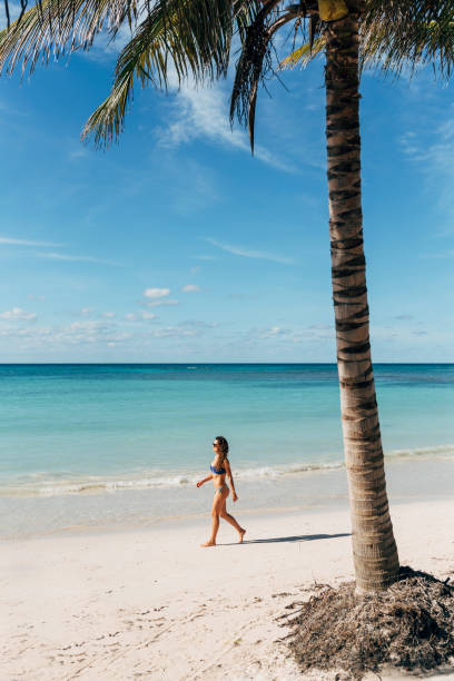 istock Young woman relax on the beach. 890868218