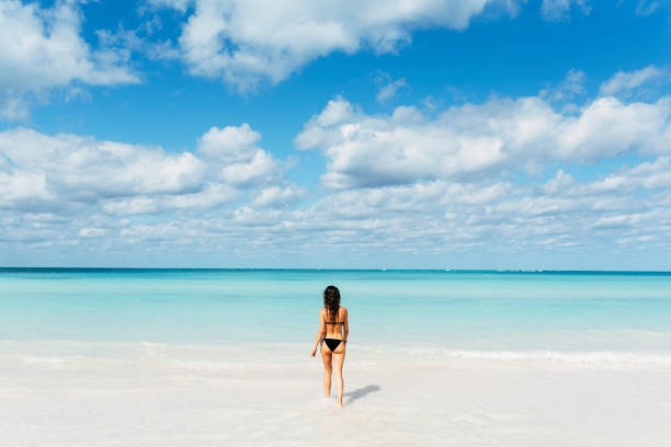istock Young woman relax on the beach. 890868220