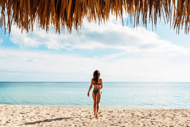 istock Young woman relax on the beach. 890868228