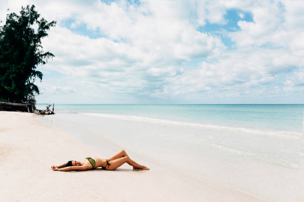 istock Young woman relax on the beach. 890871896