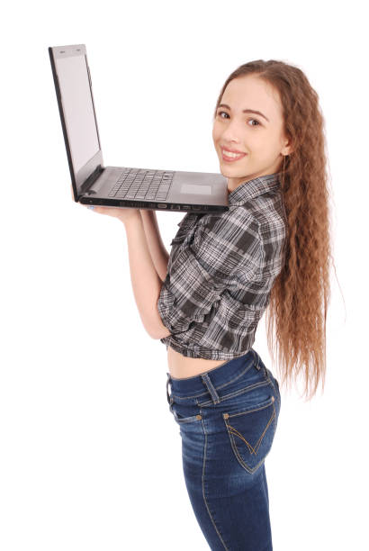 istock Young girl standing and using a laptop 890874204