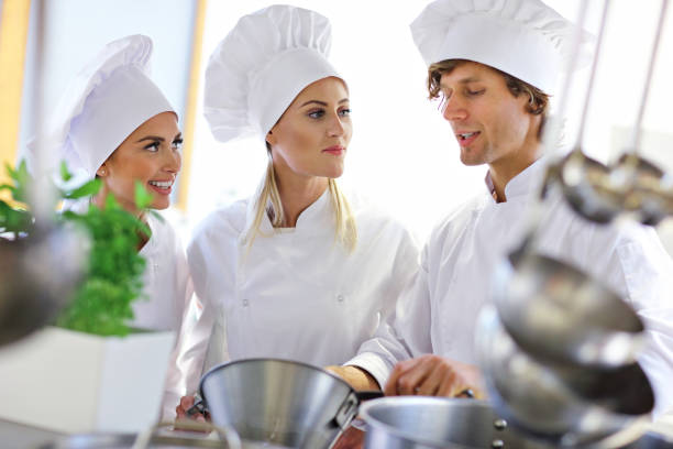istock Busy chefs at work in the restaurant kitchen 890882778