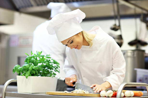 istock Busy chefs at work in the restaurant kitchen 890884198