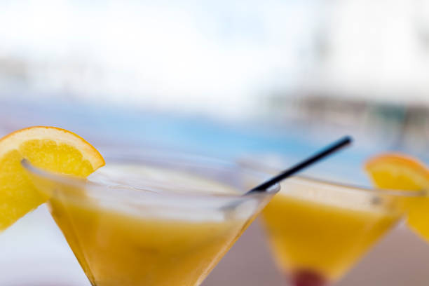 istock Two refreshing mango cocktails made with rum and fruit juices. 890886724