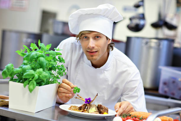istock Busy chef at work in the restaurant kitchen 890886950
