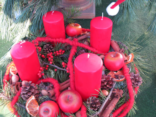 istock Autumnal wreath with four red candles 890887028