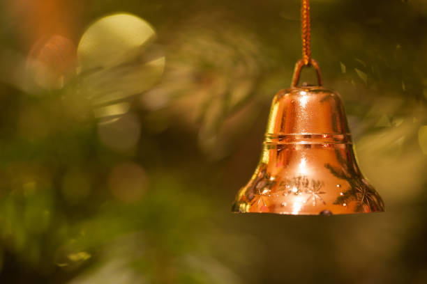 istock Little golden bell Christmas decoration with copy space 890887410
