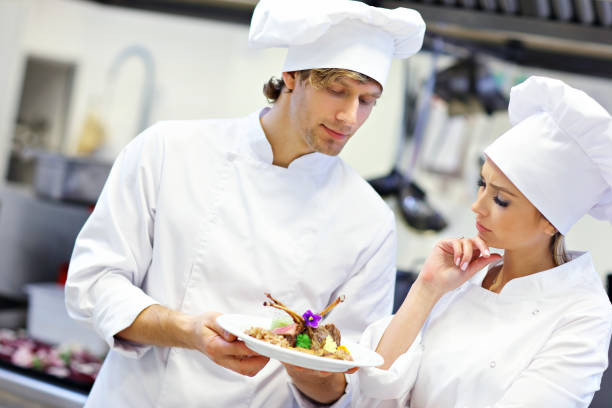 istock Busy chefs at work in the restaurant kitchen 890887472