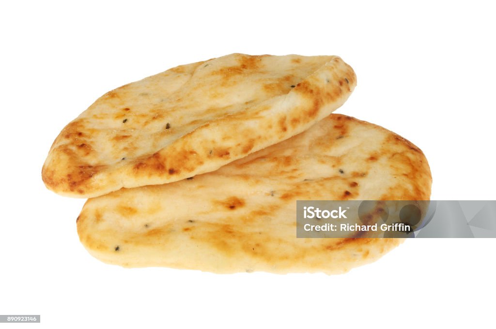 Two naans Two flamebaked naan breads isolated against white Naan Bread Stock Photo