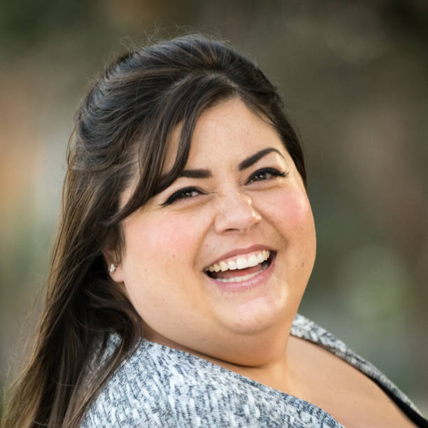 istock Smiling mid adult woman 890931746