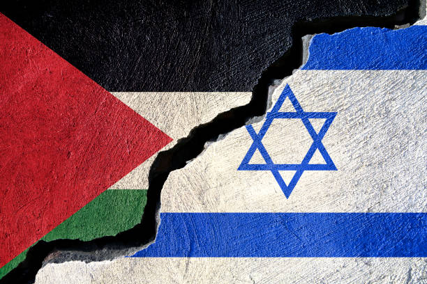 istock Concept Palestine and Israel flag on cracked background 890936984