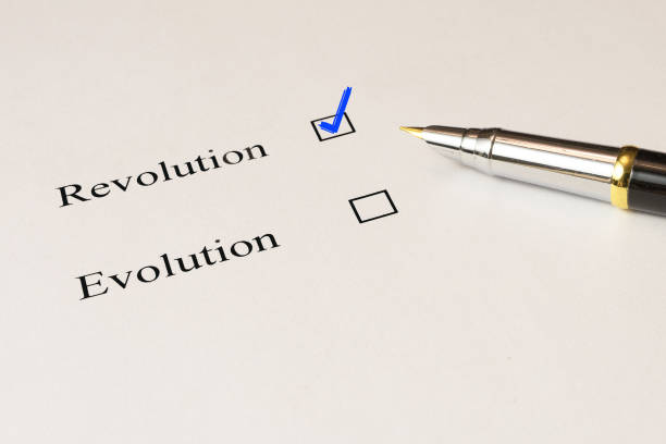 istock Questionnaire. The choice between revolution and evolution, the red check next to the choice. 890937026