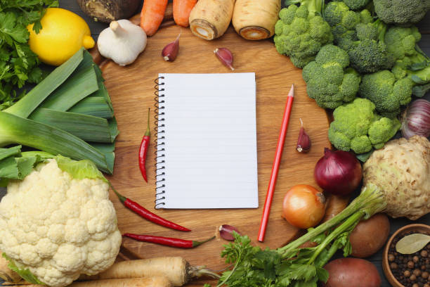istock Fresh vegetables on dark wooden background. Mockup for menu or recipe. Top view with copy space 890940452