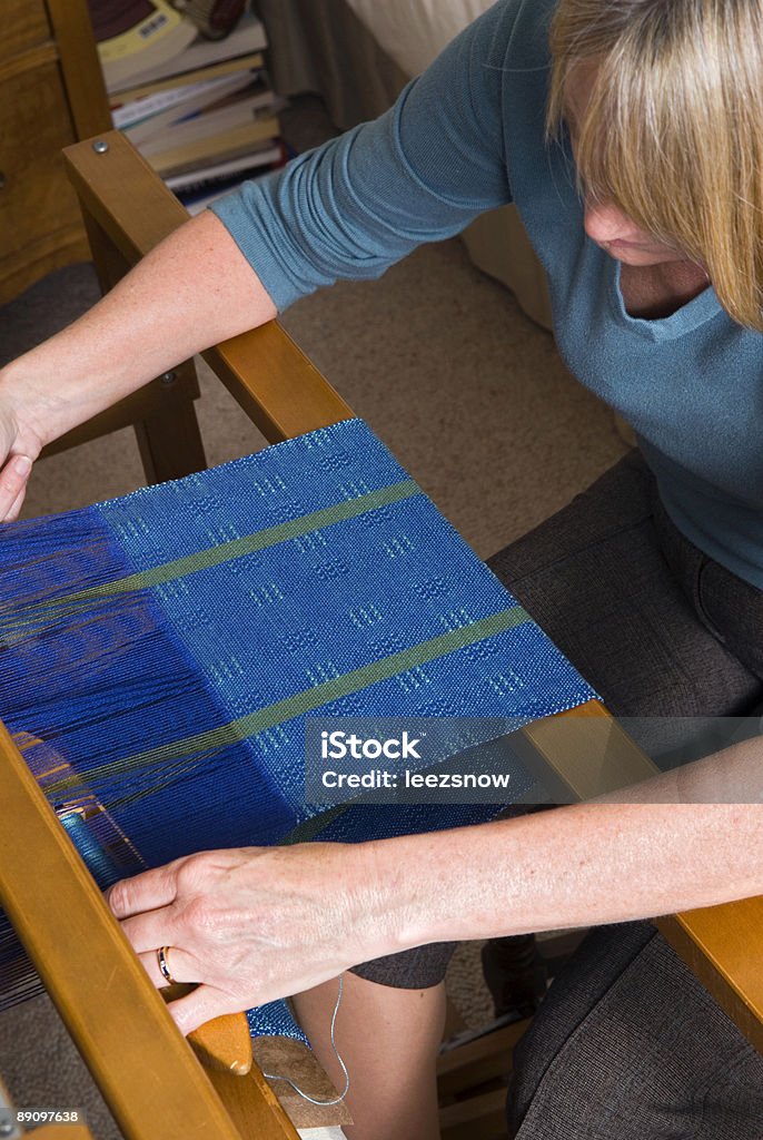 Woman Weaving on a Loom  Activity Stock Photo