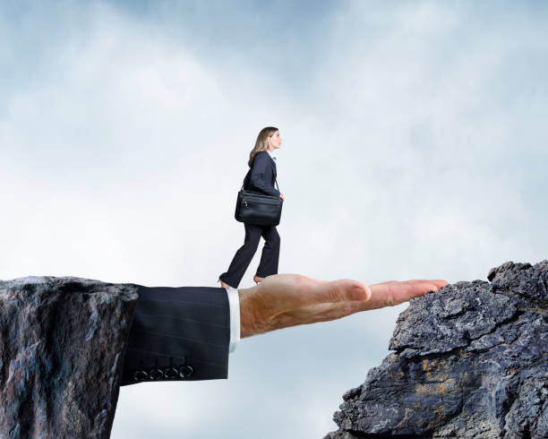 istock Businessman's Hand Bridges The Gap 890977206