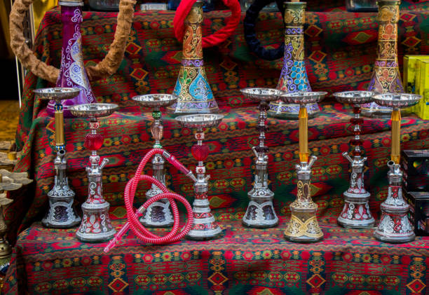 istock Group of eastern hookahs of various colors on a shelf 890985828