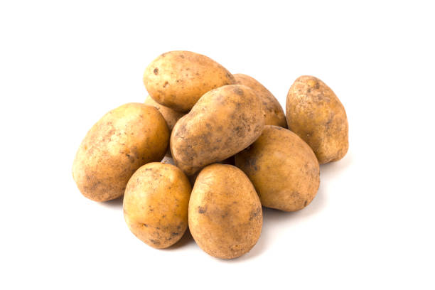 istock Pile of raw potatoes on a white background 890994664