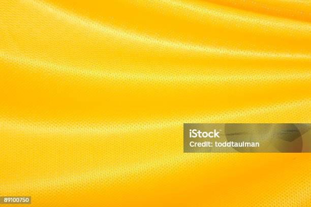Tejido Amarillo Saludar Con La Mano Foto de stock y más banco de imágenes de Amarillo - Color - Amarillo - Color, Jersey - Textil, Color - Tipo de imagen