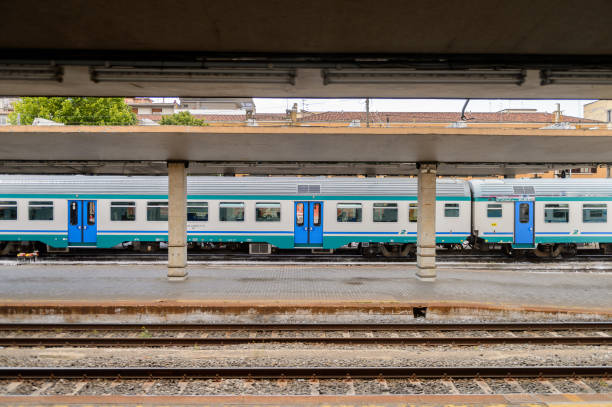 FLORENCE, ITALY - MAY 6, 2016: Trenitalia company train in movement near Florence. Trenitalia is the primary train operator in Italy