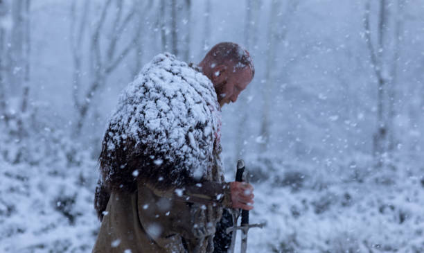 istock Weapon wielding bloody viking warrior outdoors in a winter blizzard 891009048