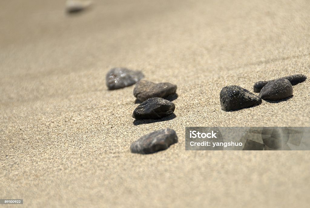 Spiaggia di ciottoli pietre - Foto stock royalty-free di Beige