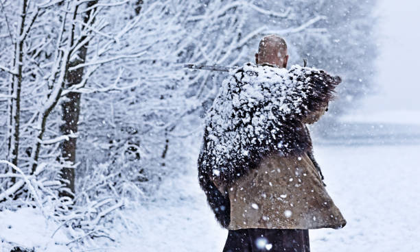 istock Weapon wielding bloody viking warrior outdoors in a winter blizzard 891009592