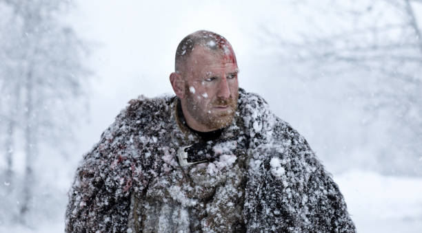 istock Weapon wielding bloody viking warrior outdoors in a winter blizzard 891009866