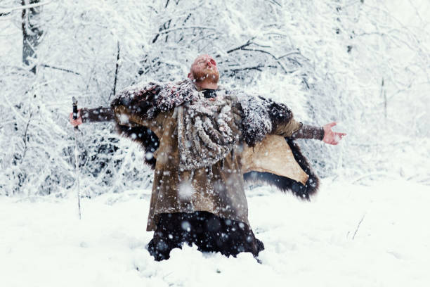 istock Weapon wielding bloody viking warrior outdoors in a winter blizzard 891010034