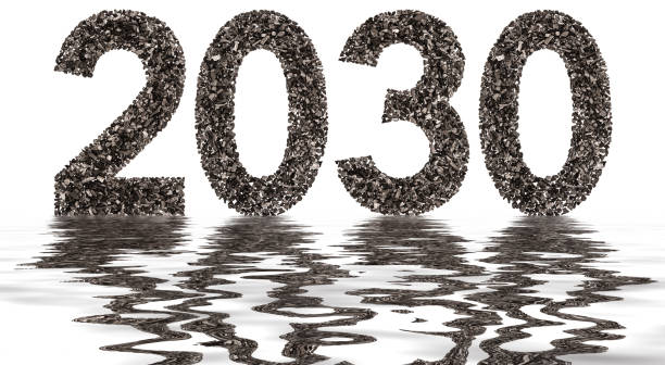 istock Numeral 2030 from black a natural charcoal, isolated on white background, reflection in water 891010290