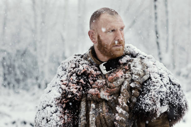 istock Weapon wielding bloody viking warrior outdoors in a winter blizzard 891010350