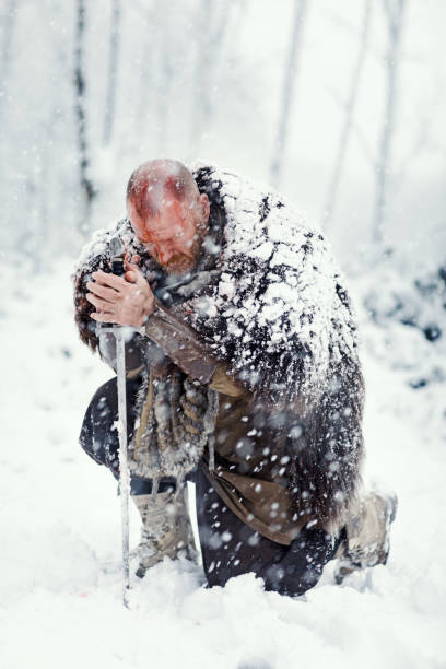 istock Weapon wielding bloody viking warrior outdoors in a winter blizzard 891010810