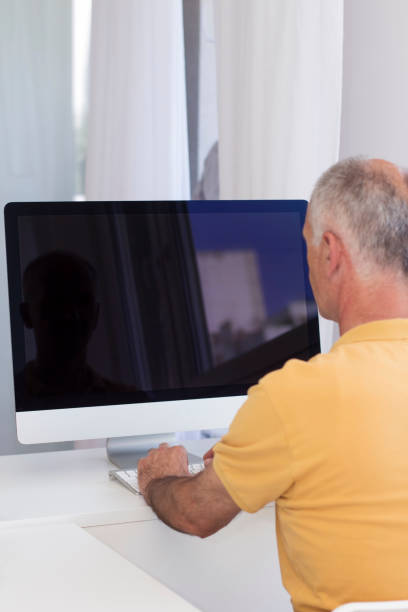 istock Senior businessman working from home 891010876